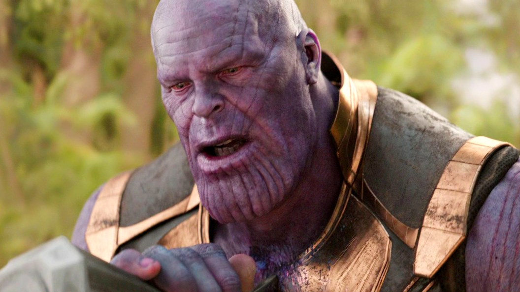 Thanos being stabbed by Thor with Stormbreaker in Avengers Infinity War